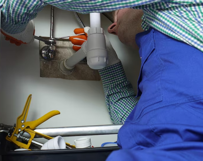  Plumber using acoustic equipment to detect hidden water leak in a Redfern home