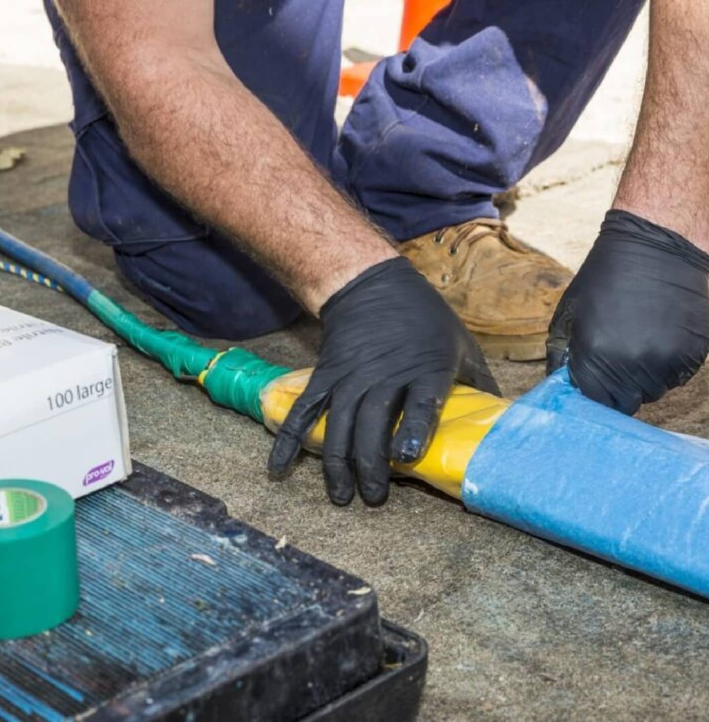 Pipe relining technician repairing underground drain pipes without excavation in Erskineville backyard