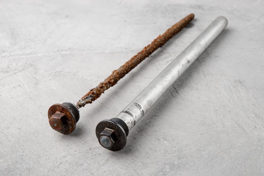 Rusted sacrificial anode rod removed during routine hot water plumbing maintenance