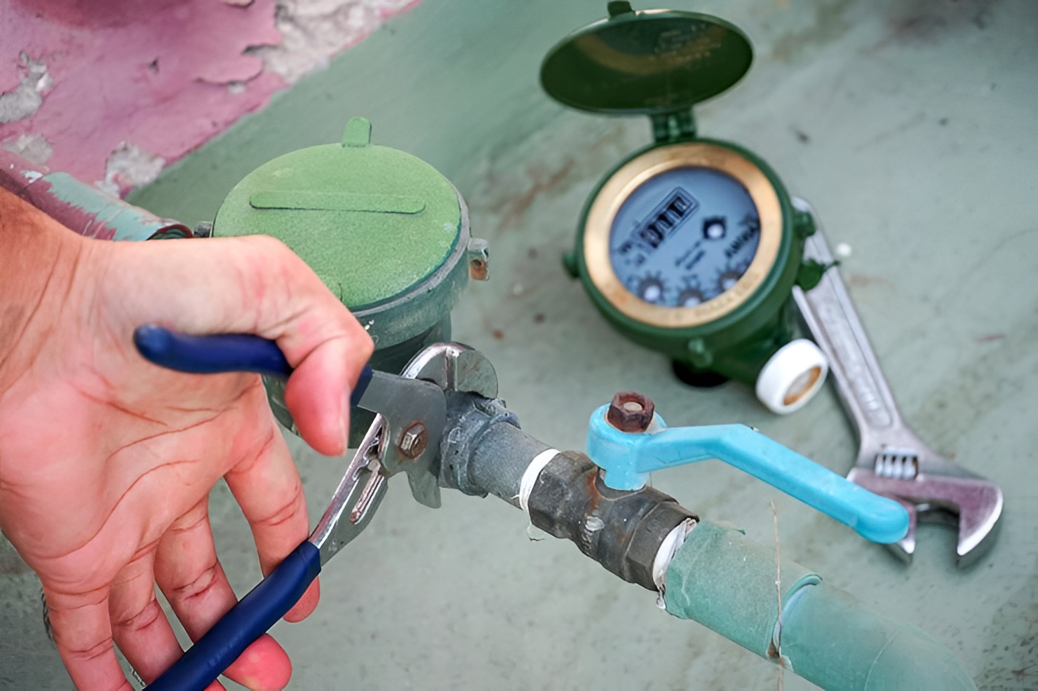 Professional plumbing maintenance installing a pressure limiting valve to keep home water pressure below 500 kPa